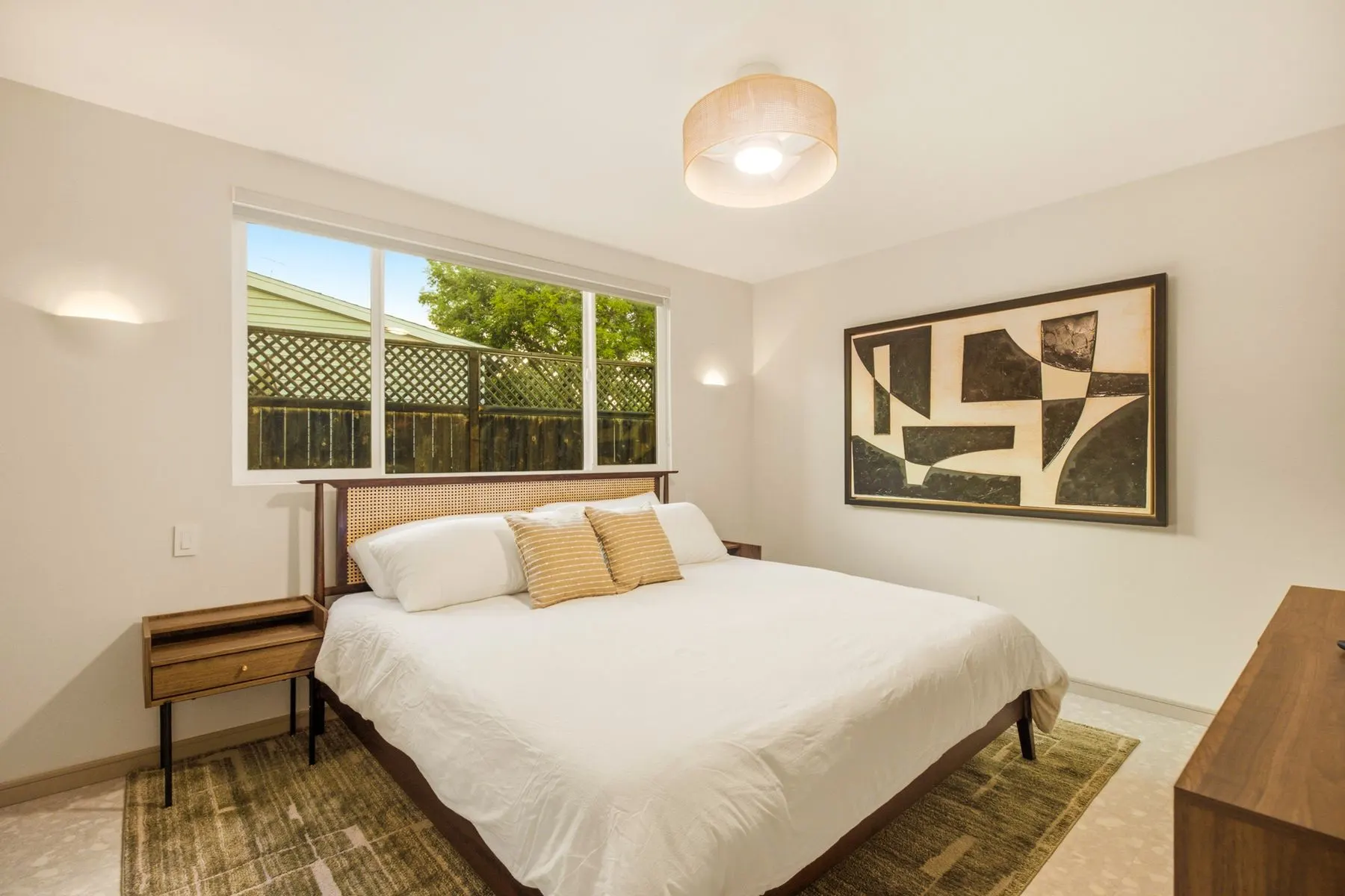 Wake up to the backyard through the picture window