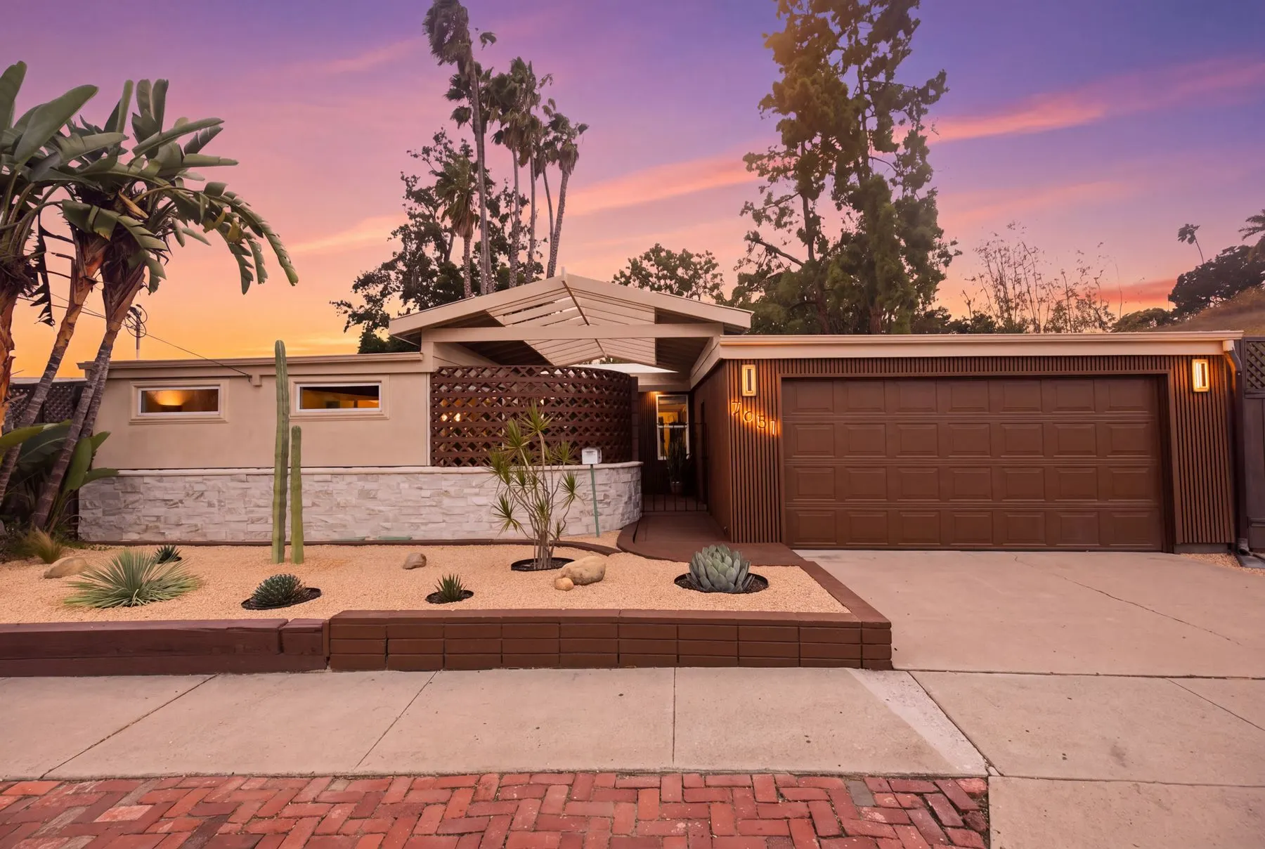 The front at dusk: new siding and a desert garden