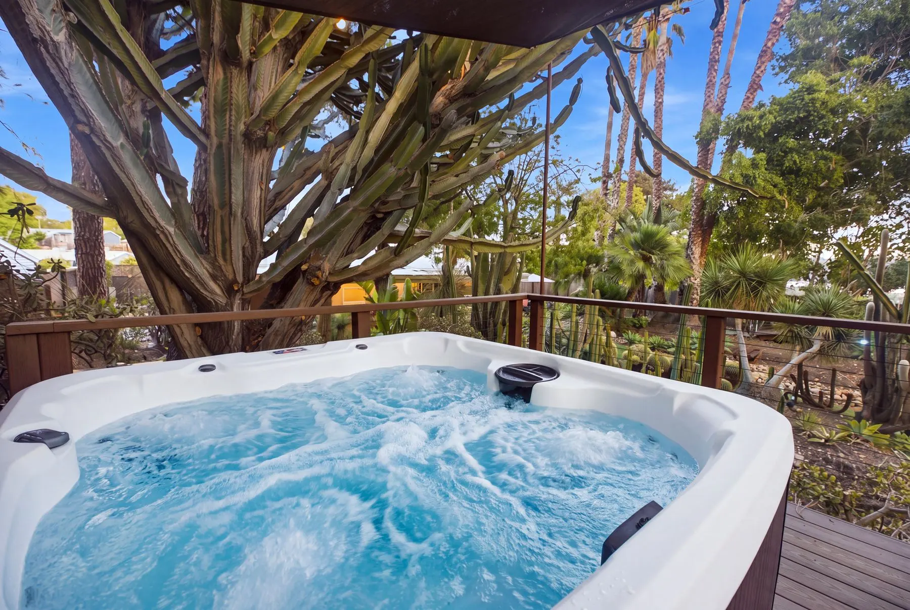 The hot tub by day, under the trees