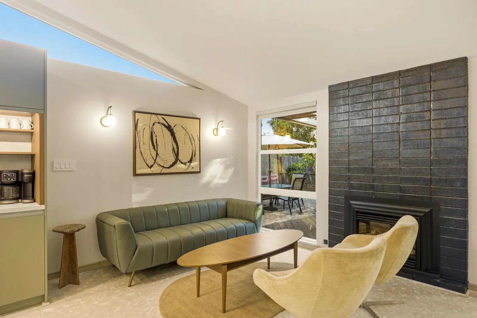 Lounge with black brick fireplace