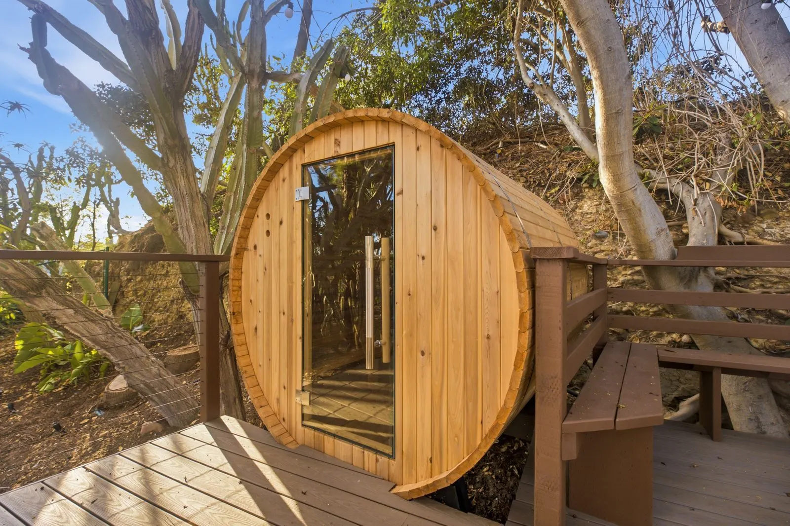Cedar barrel sauna on the deck among the trees